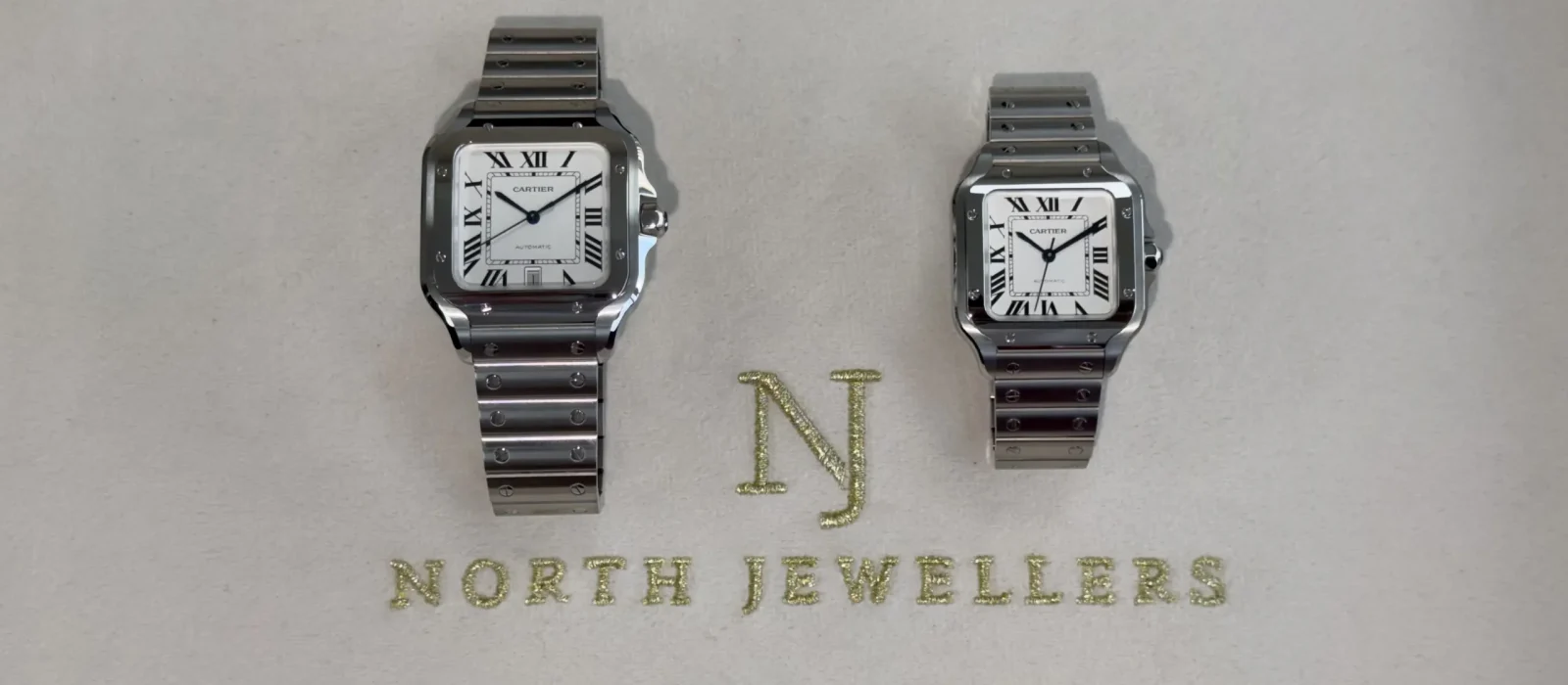 Cartier Santos Large and Medium watches side by side showing the size difference